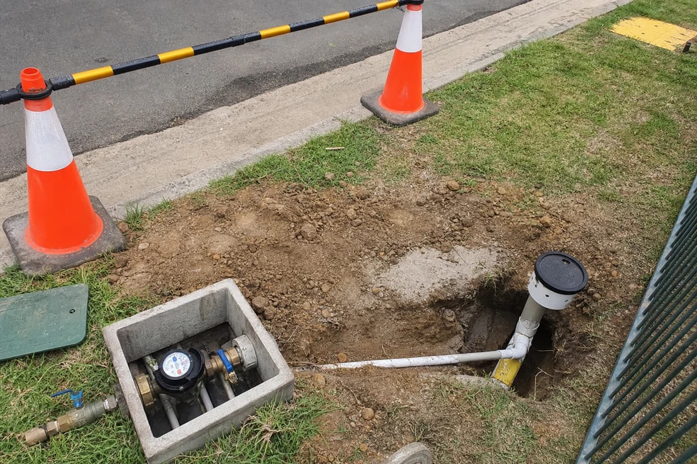 Minor works wastewater service connection and valve assembly at compact suburban excavation in Sydney